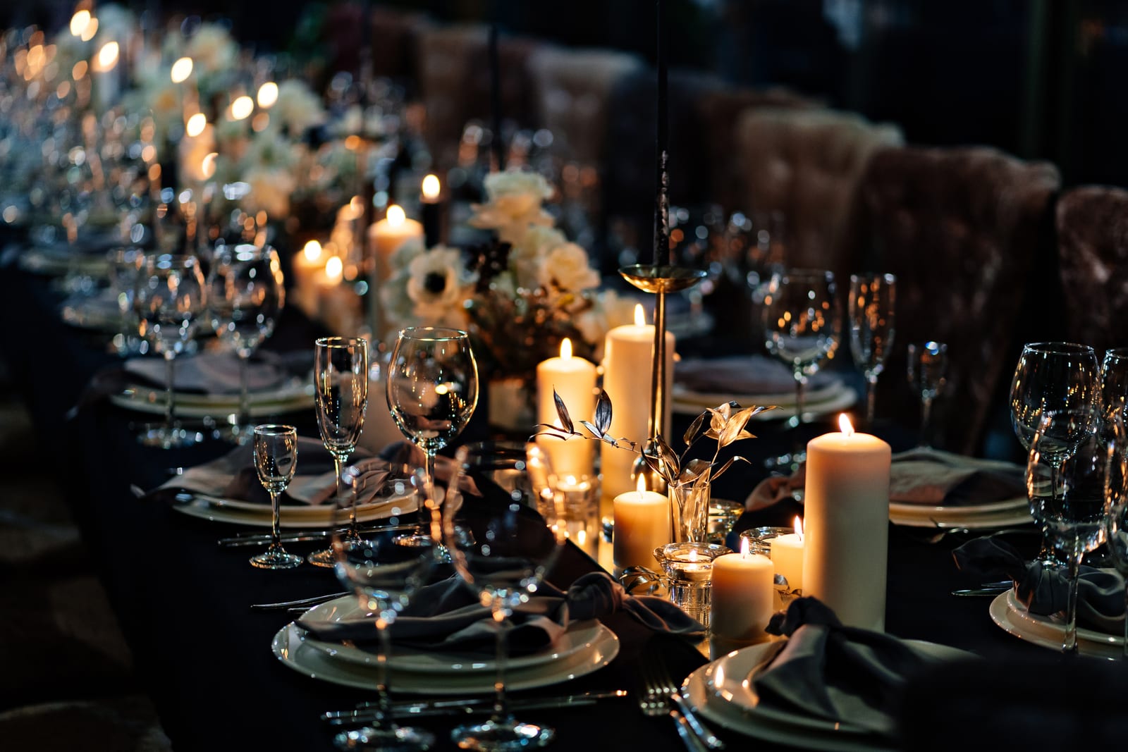 A candlelit table prepared for dinner