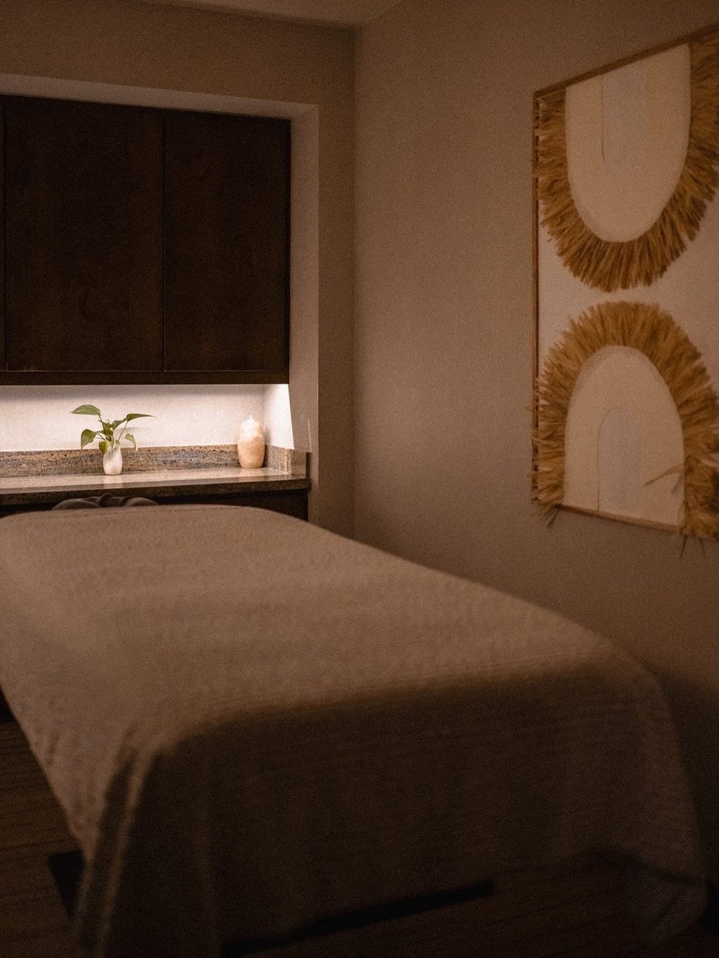Warm wood and natural textures in a quiet treatment room